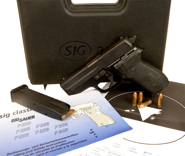 Deactivated SIG P228 With Accessories