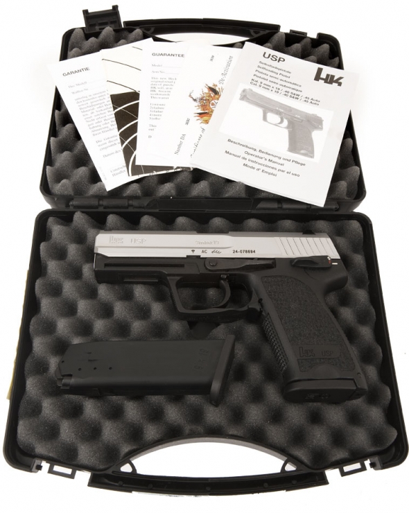 A Heckler and Koch USP stainless in its original box 